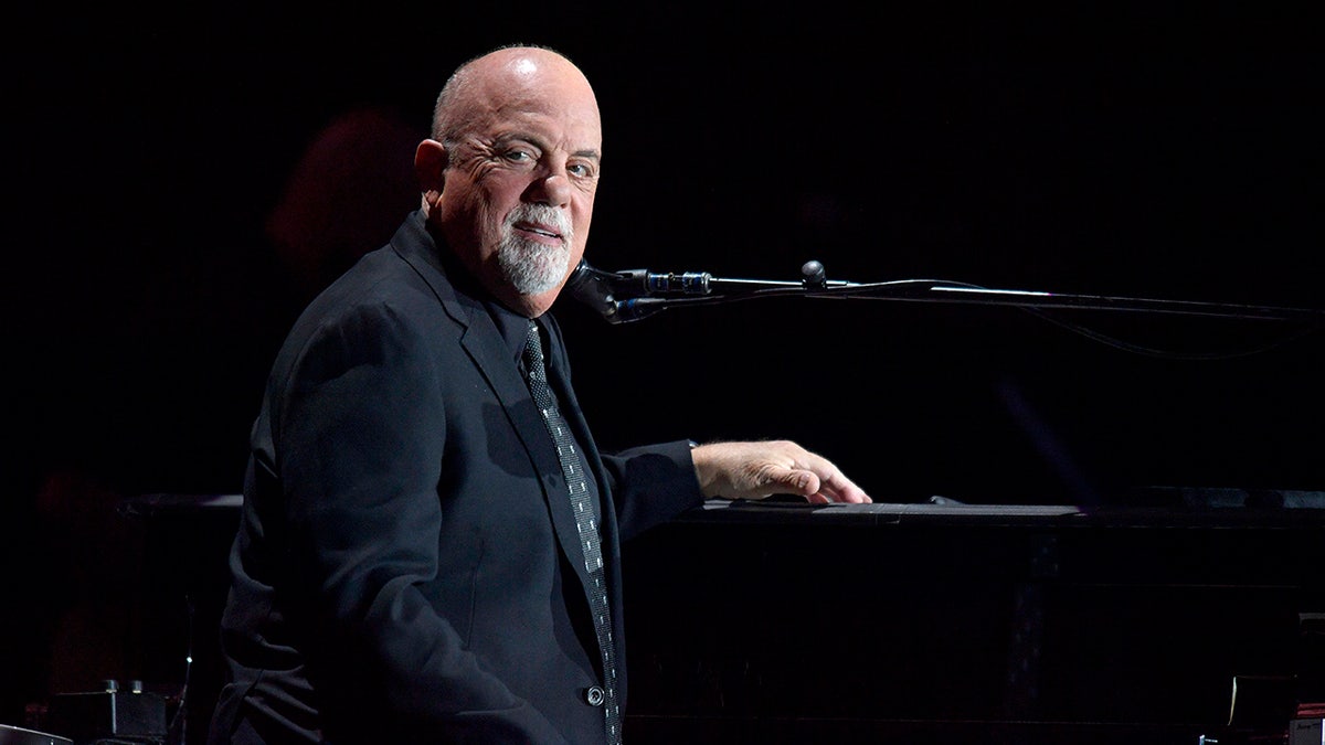 Billy Joel playing piano