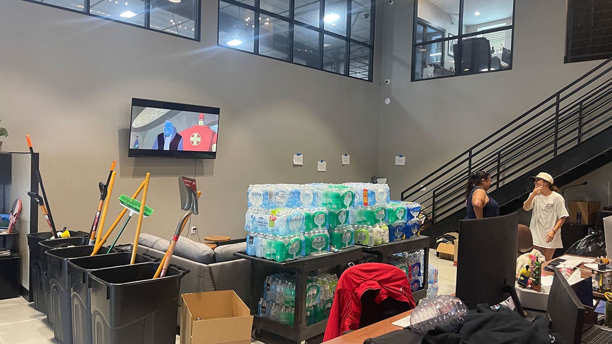 Supplies are piling up inside Bunker Branding, where owners Chris and Jenna Sanders are stockpiling aid to help flood victims.