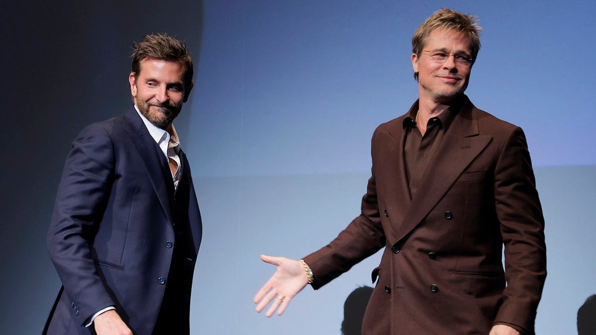 Bradley Cooper and Brad Pitt on stage