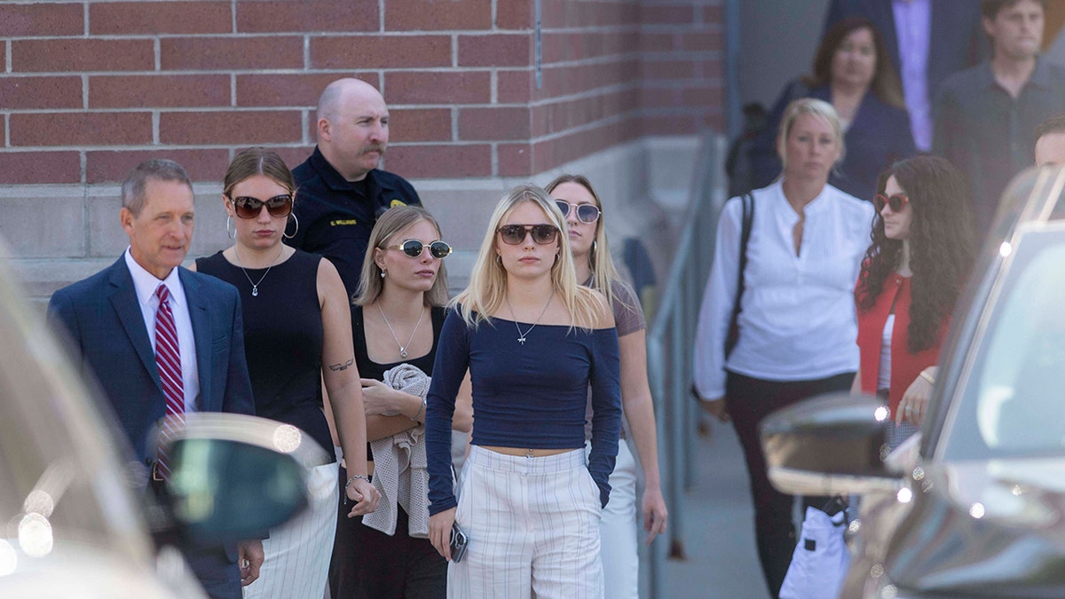 Attendees exit the court after Bryan Kohberger is sentenced to life in prison.