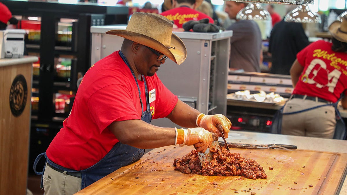 An employee clears the coast BBQ in Brunswick on July 1, 2025 during the magnificent opening of the BUNC-EE.