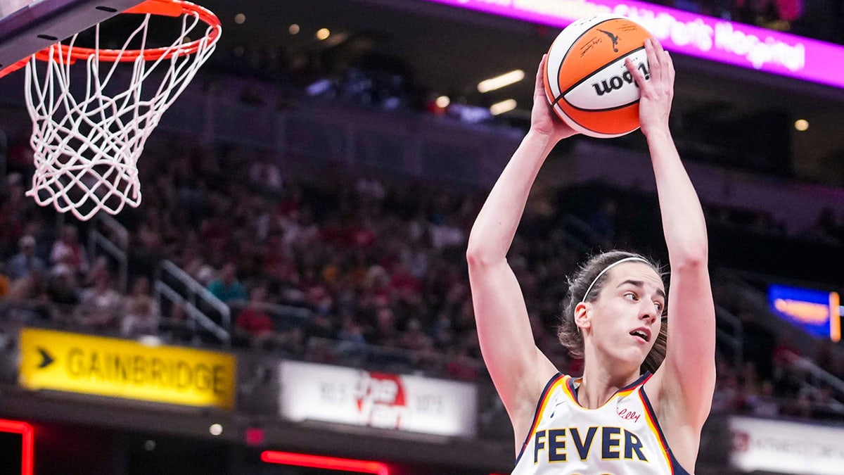 Caitlin Clark plays the ball