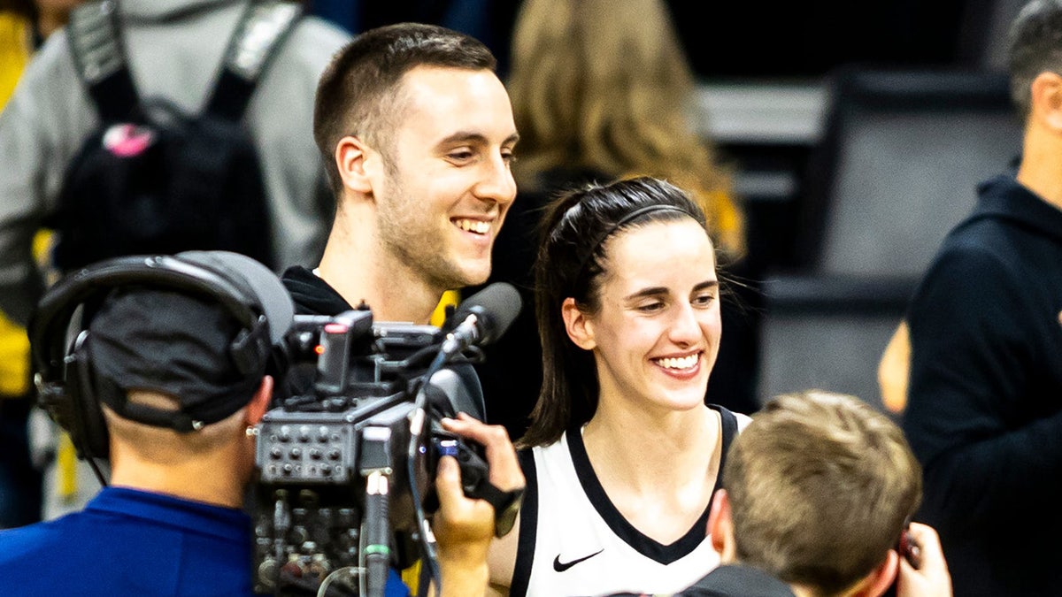 Connor McCaffery and Caitlin Clark in February 2024