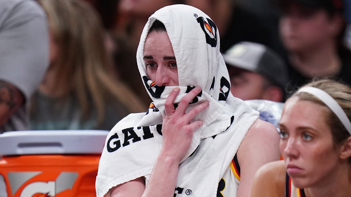 Caitlin Clark upset on the bench