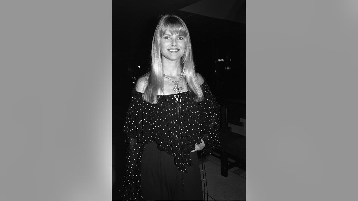 a black and white photo of Christie Brinkley in the 70s