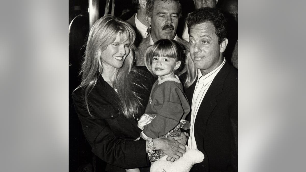CHristie Brinkely and Billy Joel with their daughter in 1988