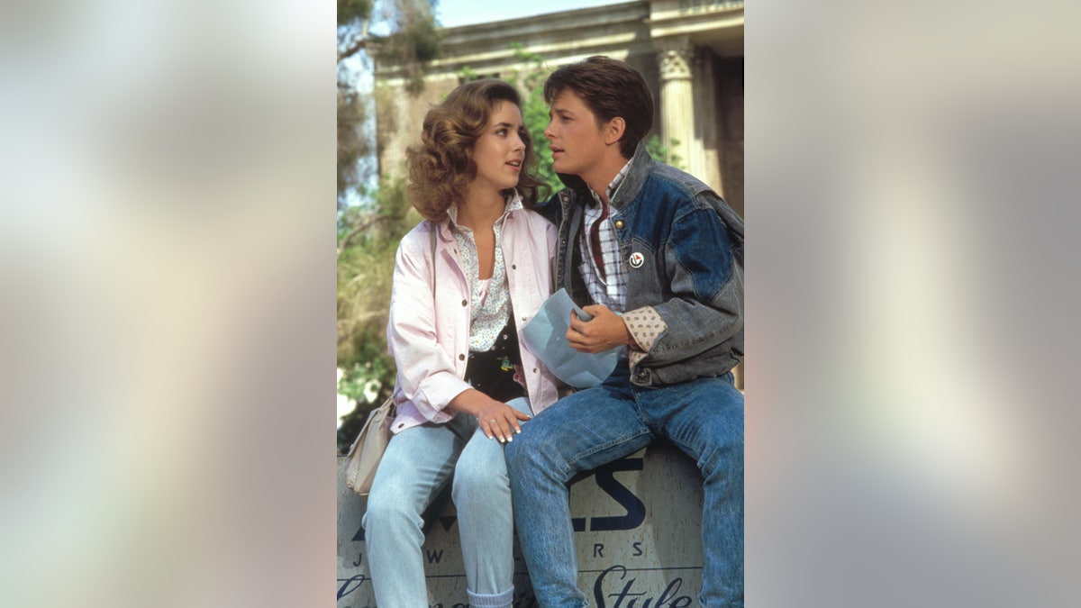 Claudia Wells in character as Jennifer Parker talking to Michael J. Fox acting as Marty McFly.