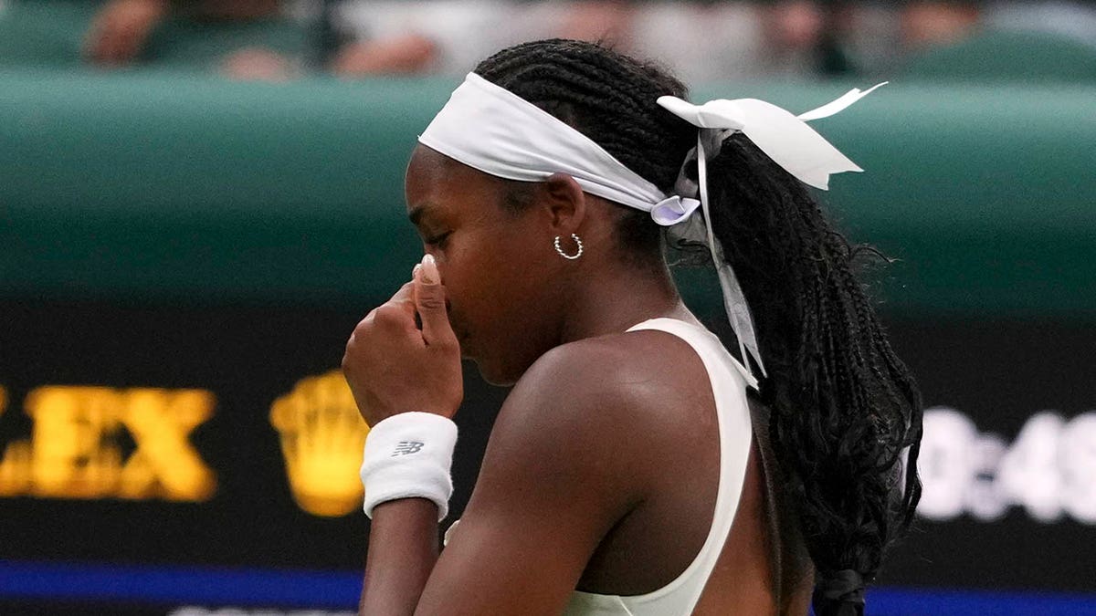 Coco Gauff reacts on the court