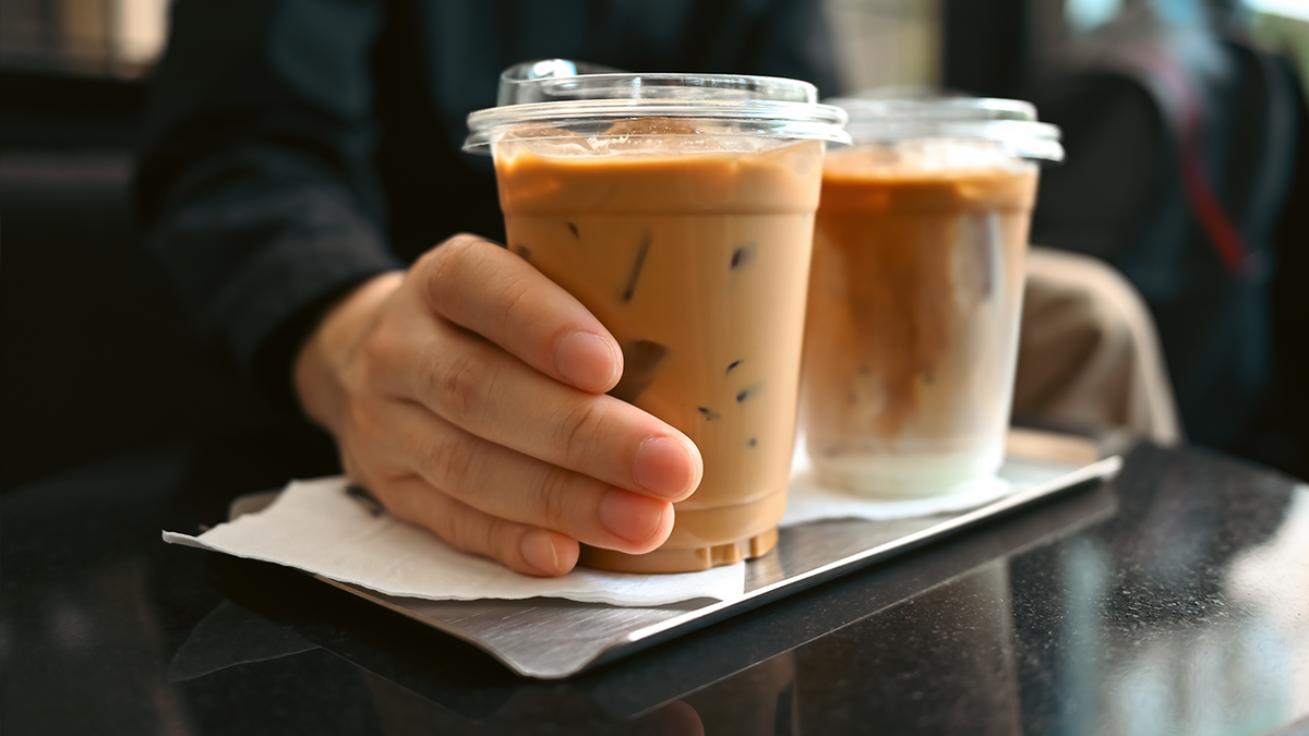 hand holding Iced coffee