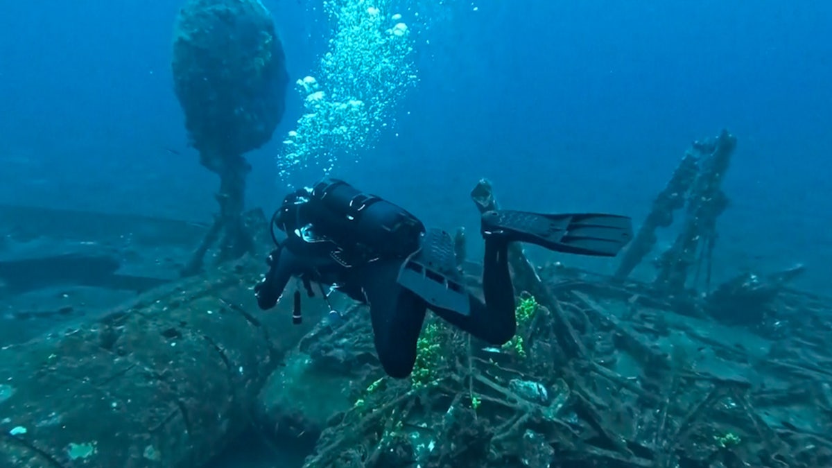 Diver near the wreckage of the ship