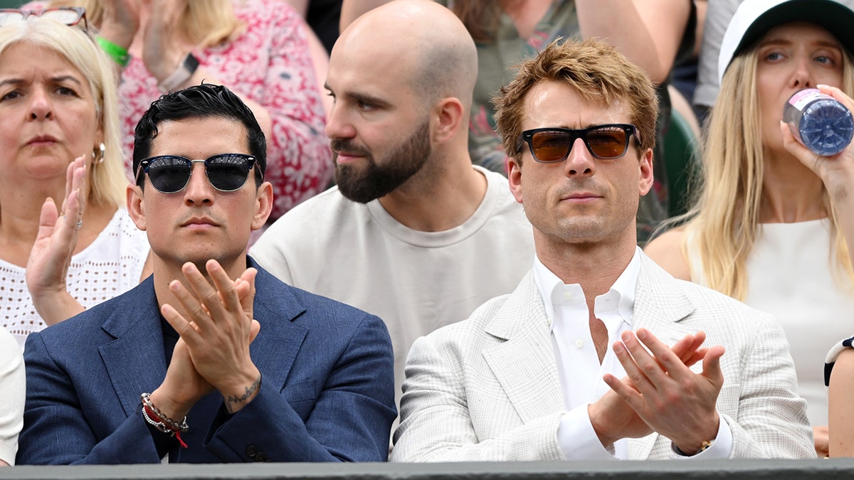 Danny Ramirez and Glenn Powell Clap, while watching Tennis in Wimbledon.