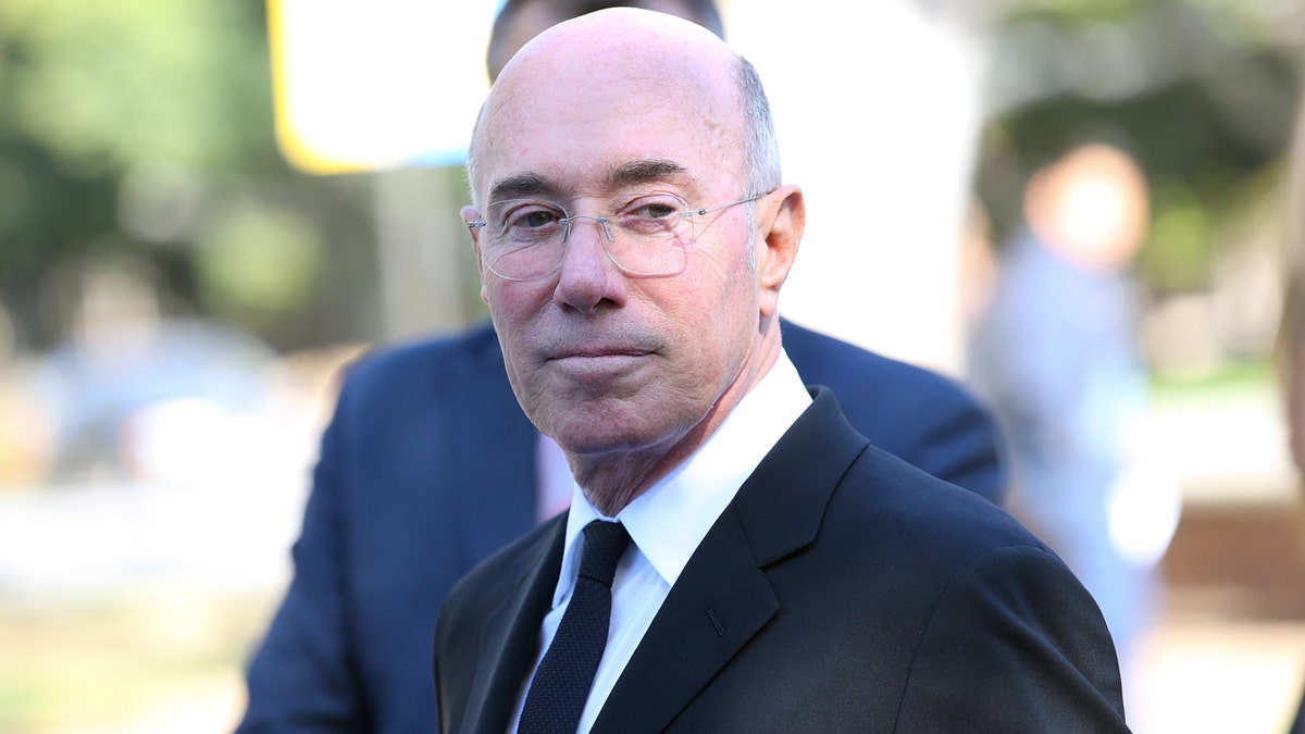 David Geffen takes a photo