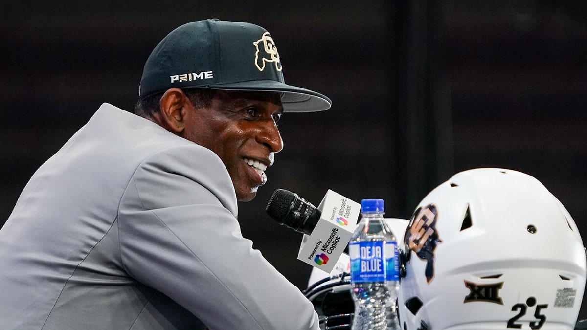 Deion Sanders smiles