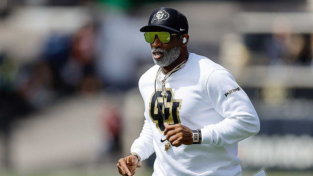 Deion Sanders runs