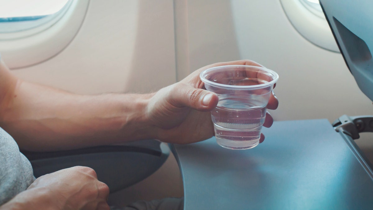 Drinking water on plane
