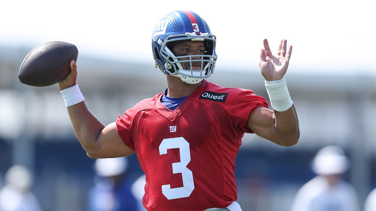 Russell Wilson throws football