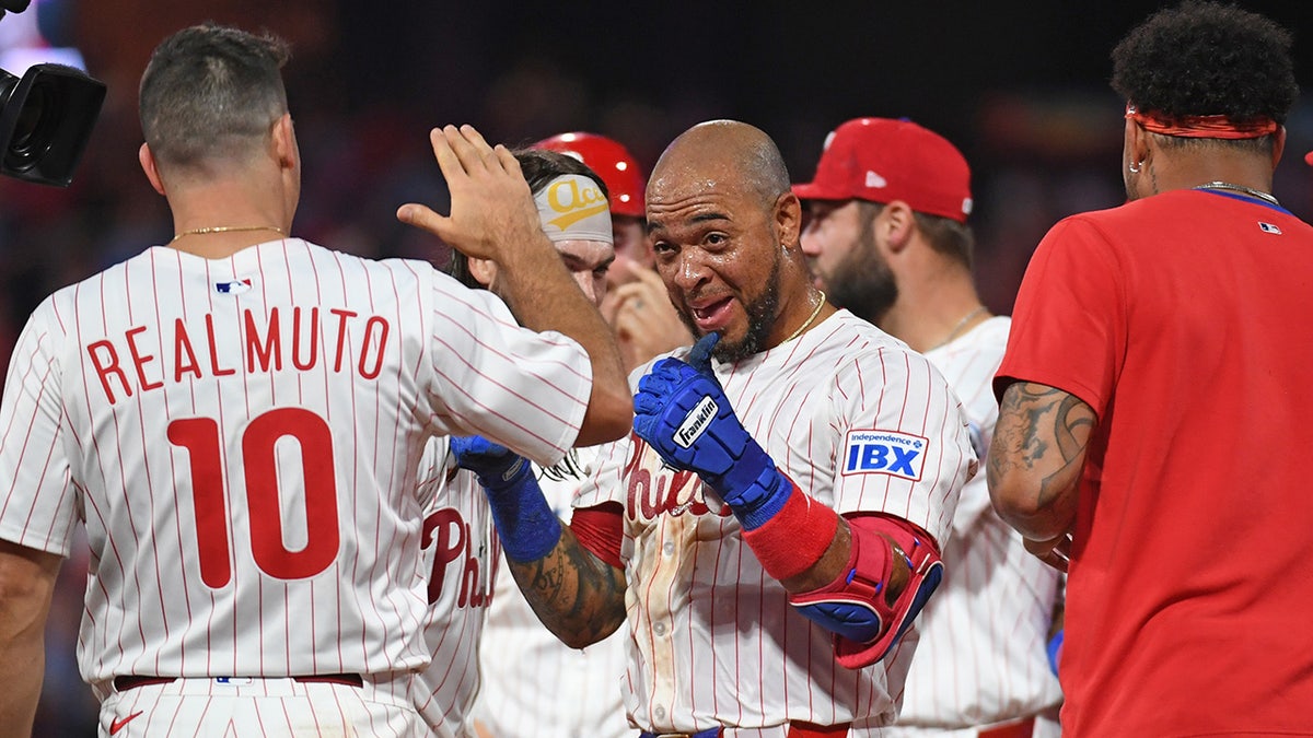 Edmundo Sosa celebrates after walk-off win