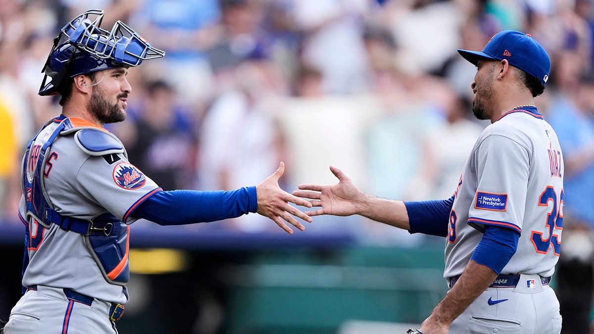 Luis Torrens and Edwin Diaz celebrate