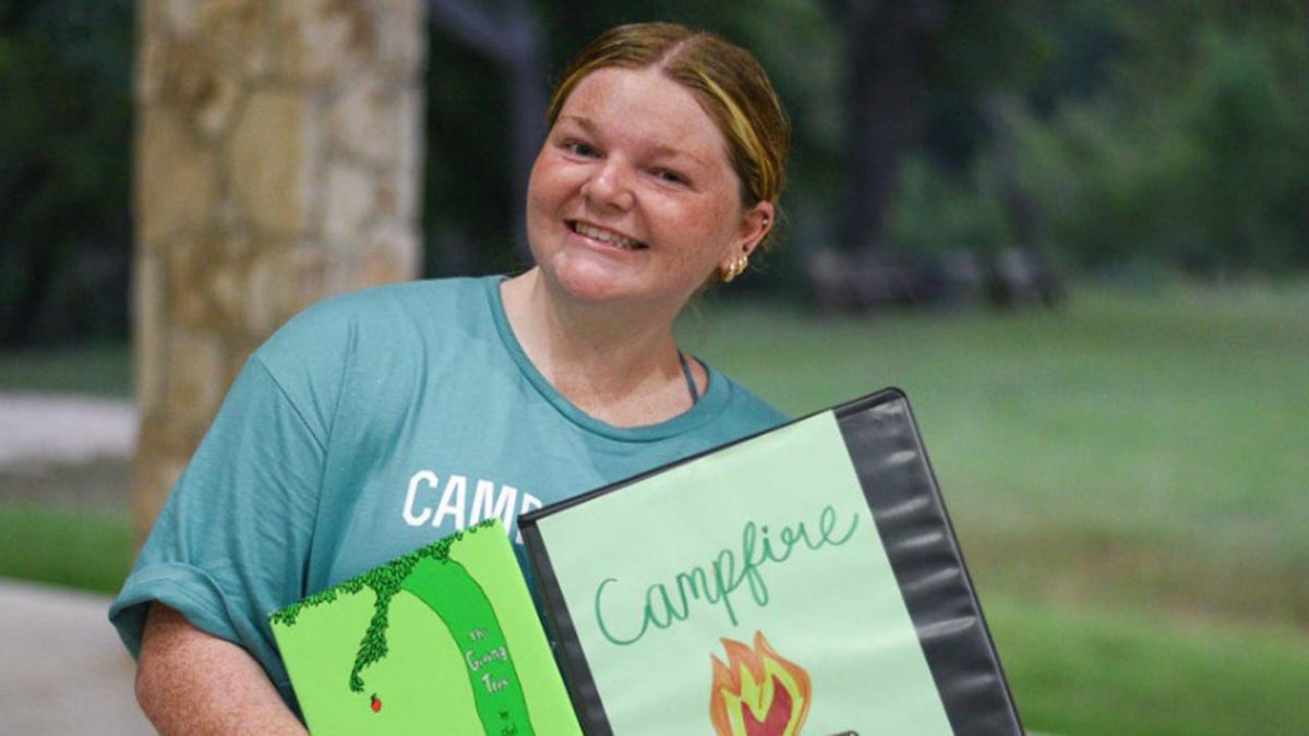 Emma Foltz with a book