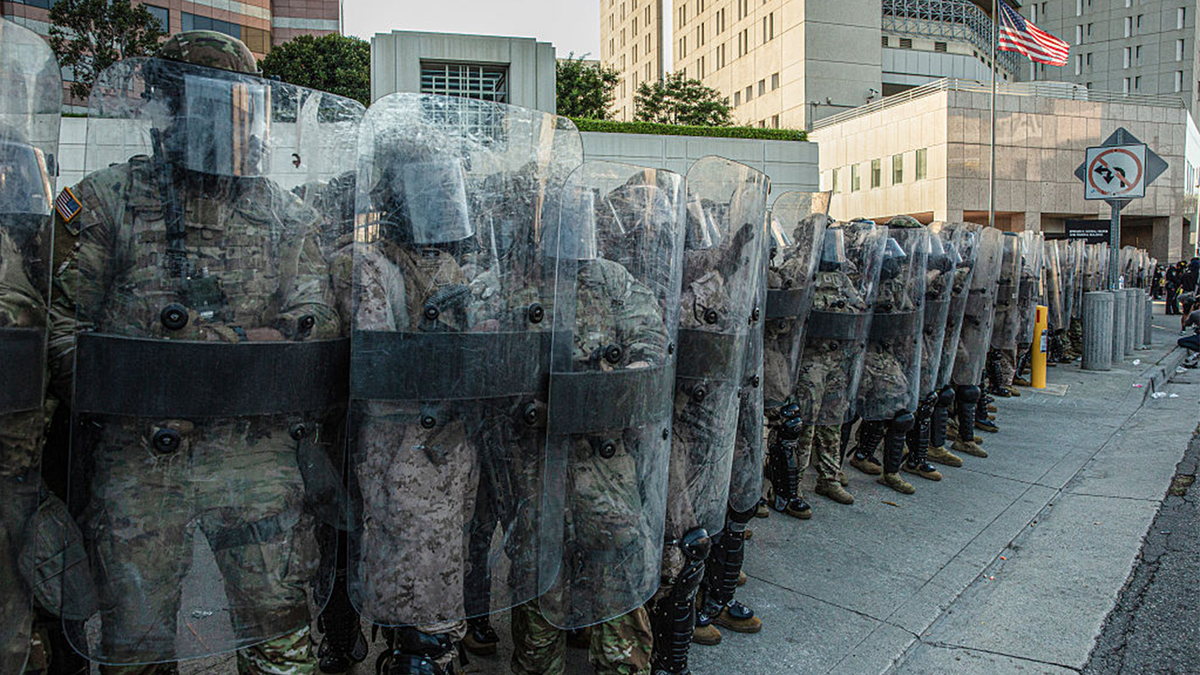 Marines at a standoff with demonstrators