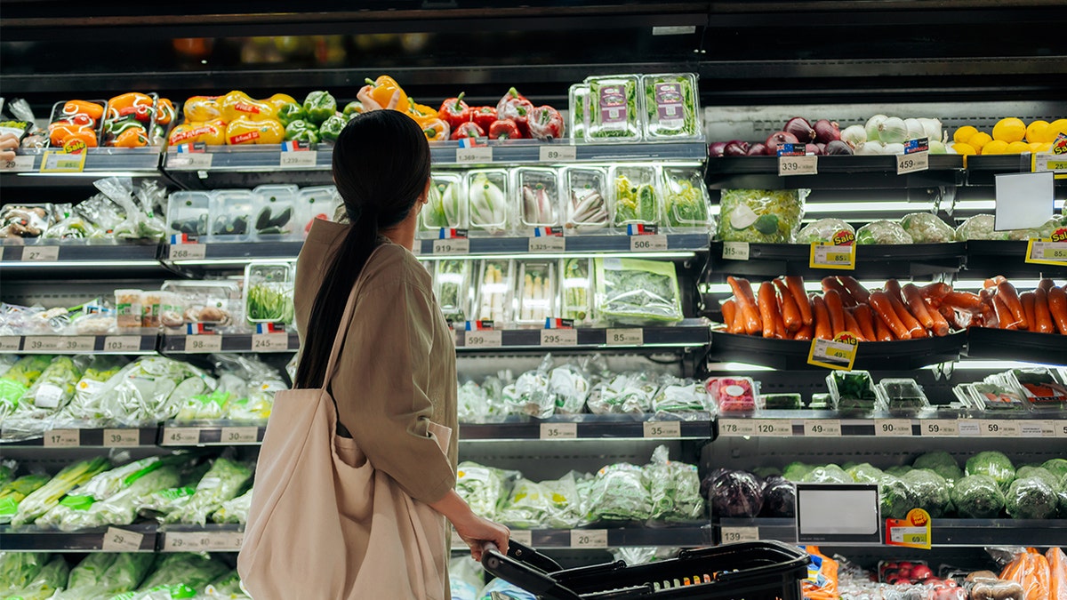 Woman shopping successful nutrient aisle