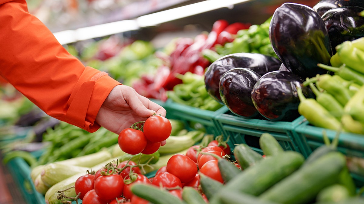 Hand reaching retired for produce