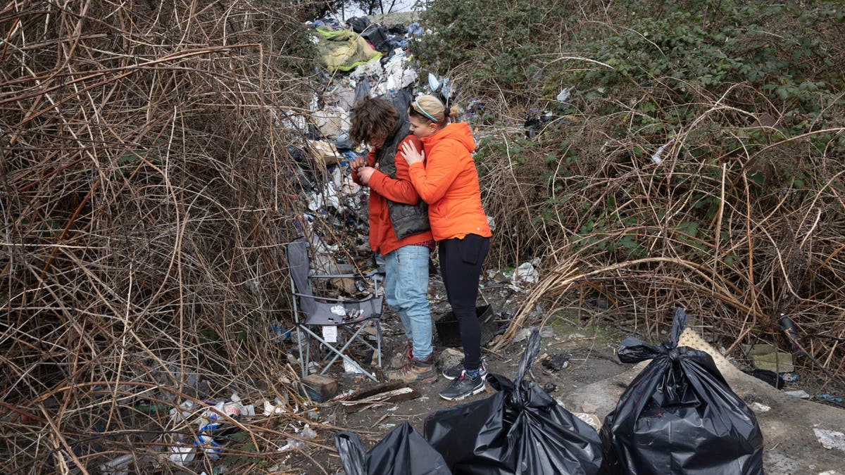Andrea Suarez and homeless man