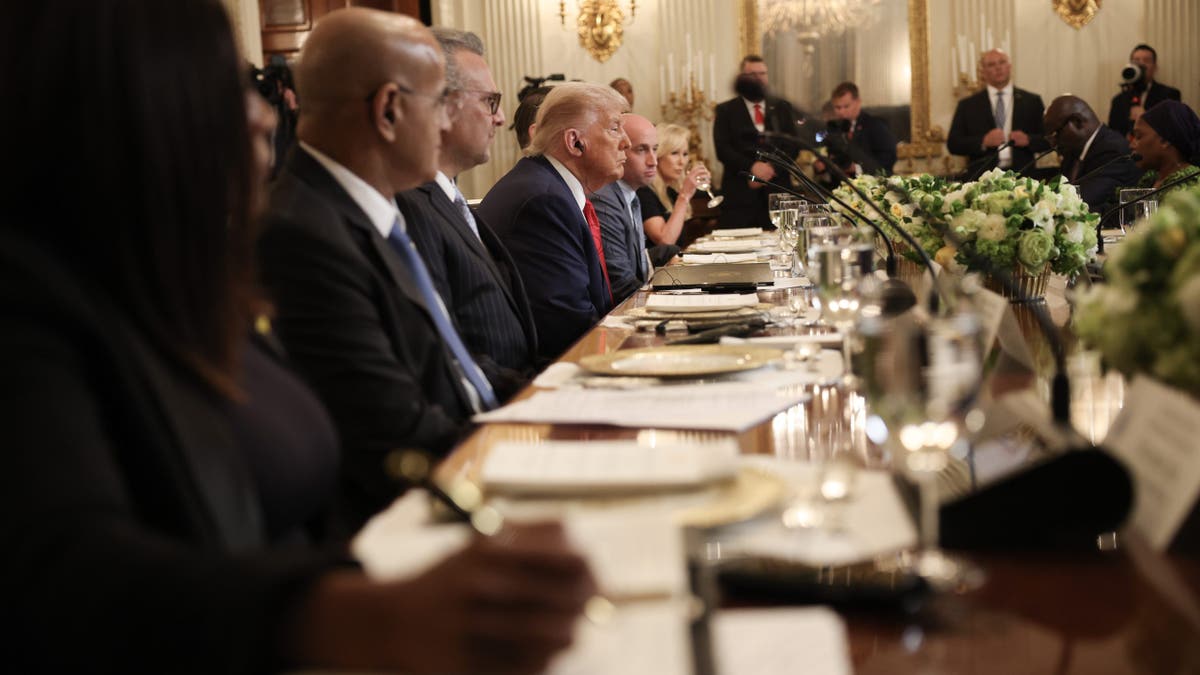 President Donald Trump listens during a multilateral lunch with African leaders in the State Dining Room of the White House July 9, 2025, in Washington.