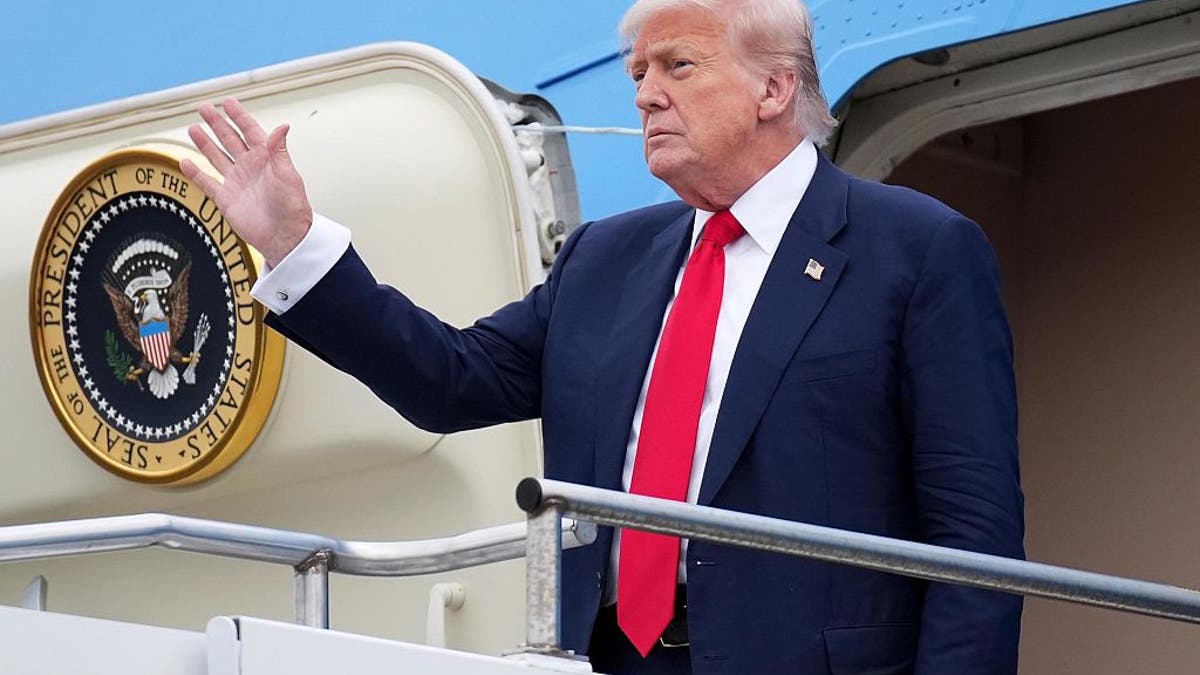 President Donald Trump acts when he arrives at Glasgow Prestwick airport on July 25, 2025, in Prestwick, Scotland. 