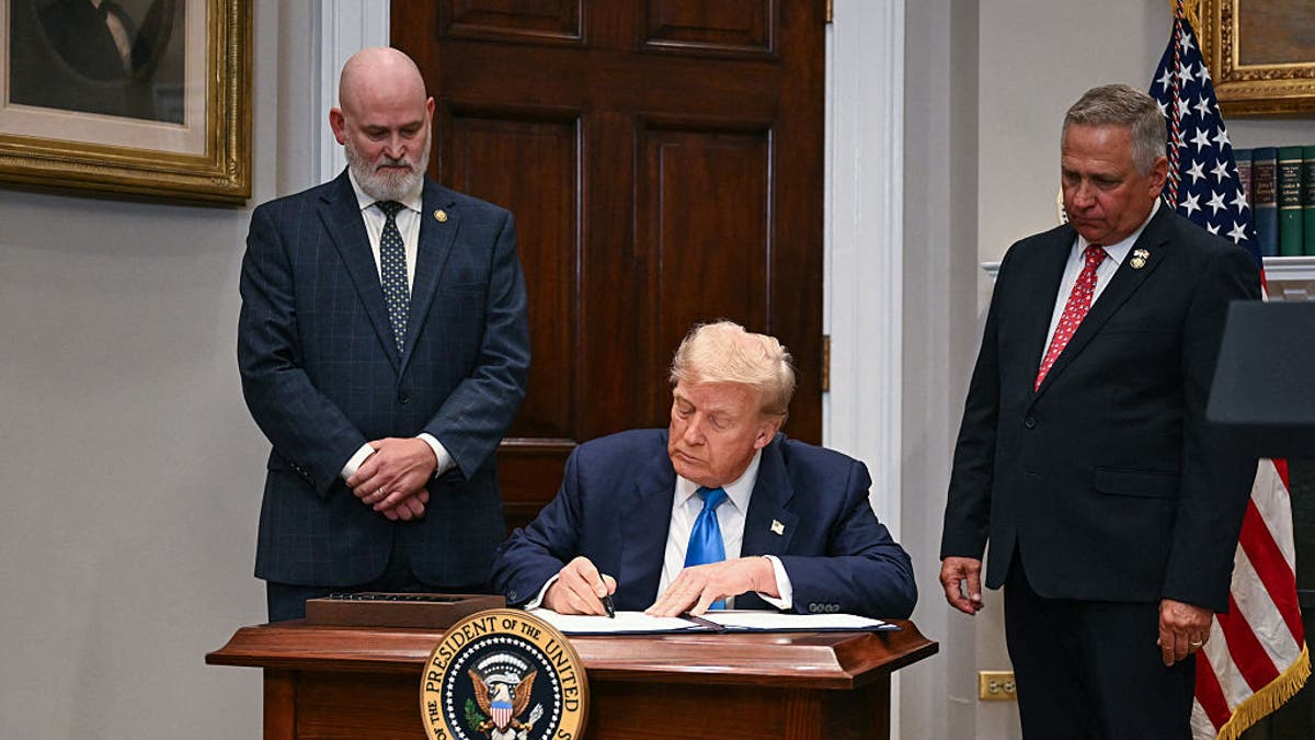 President Donald Trump signs the law on the reform of the real estate loan program goes to the Roosevelt room of the White House in Washington, July 30, 2025. (Jim Watson / AFP via Getty Images)