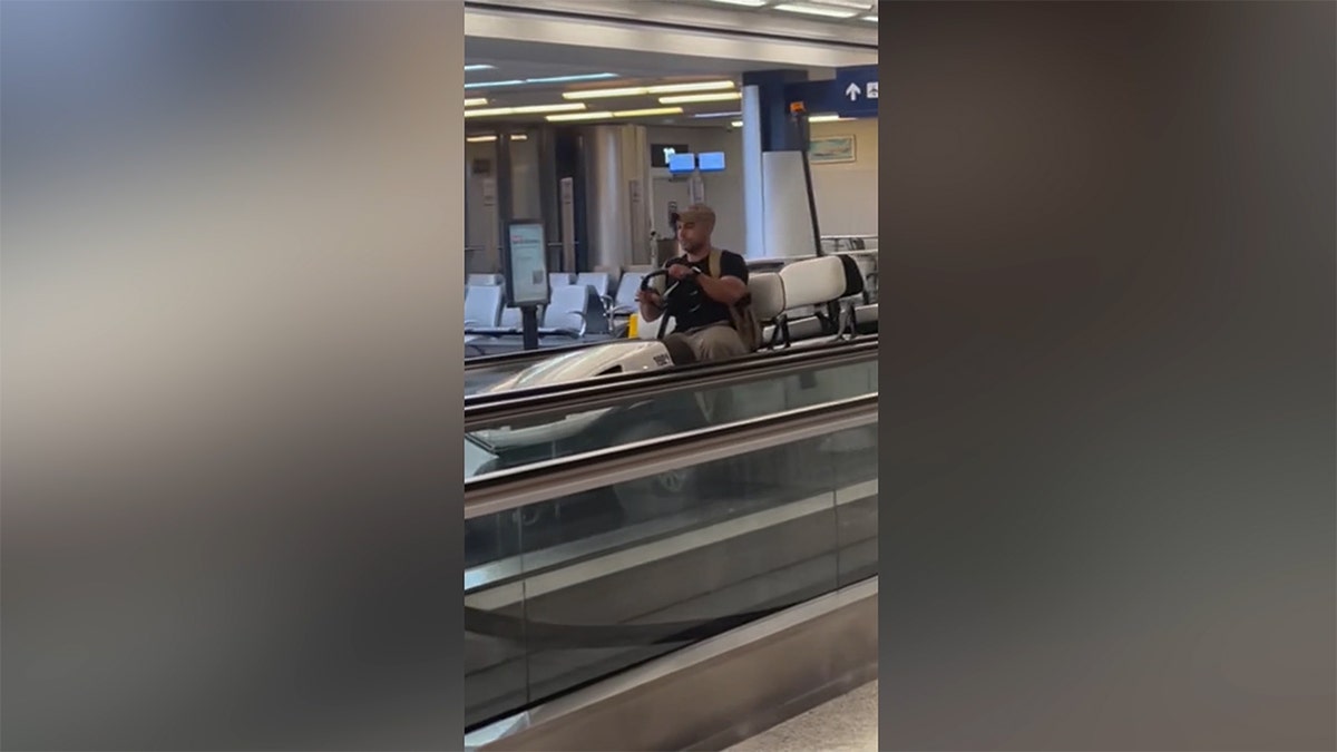 Man in the airport golf cart