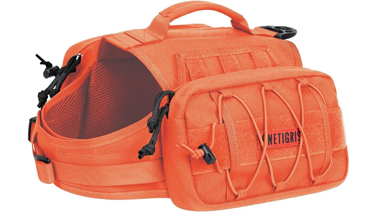 Your dog can carry its own gear in a harness backpack.