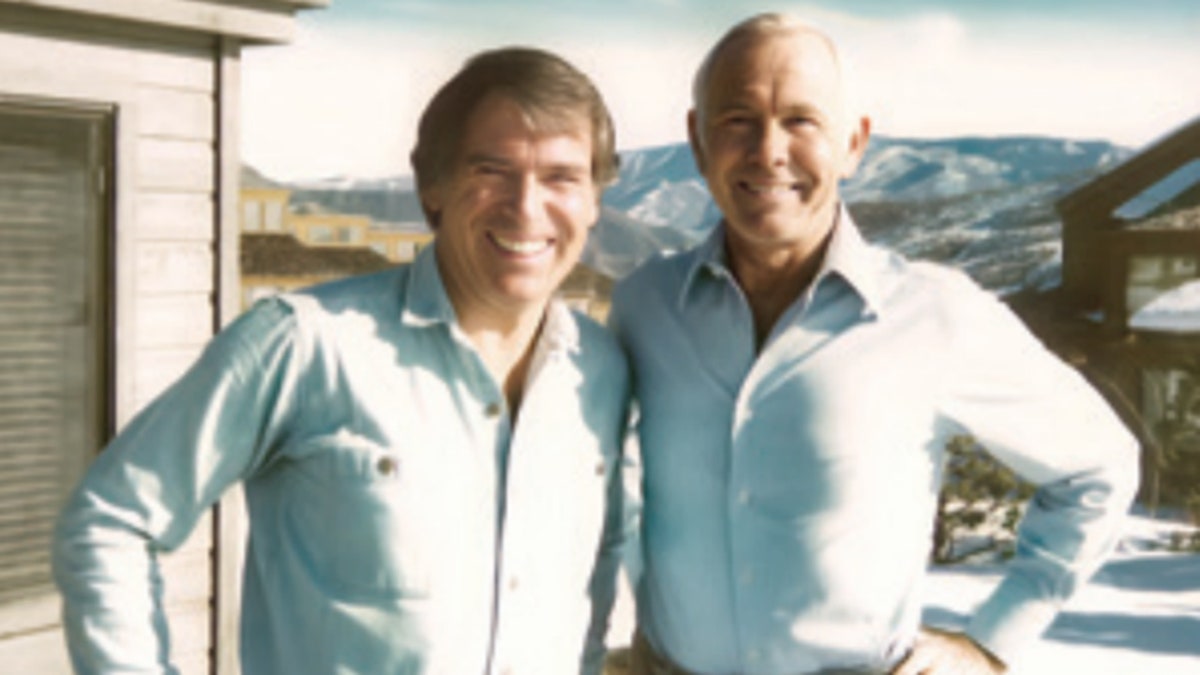 Howard Smith and Johnny Carson wearing matching shirts.