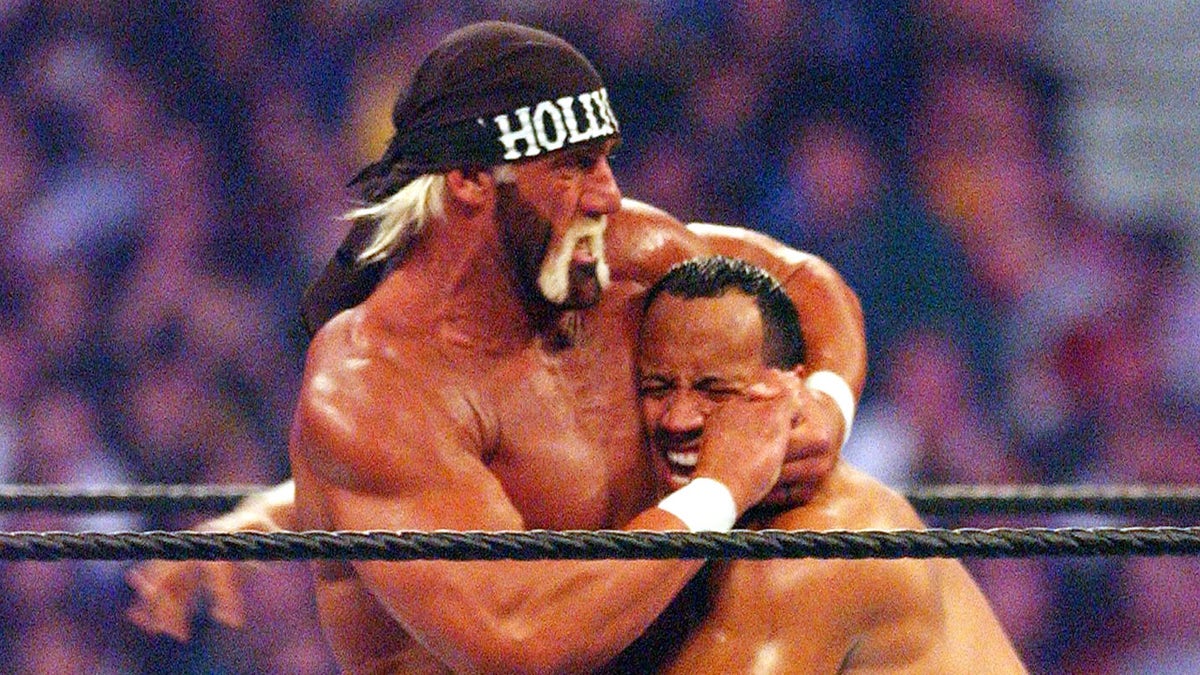 Hulk Hogan with The Rock in headlock