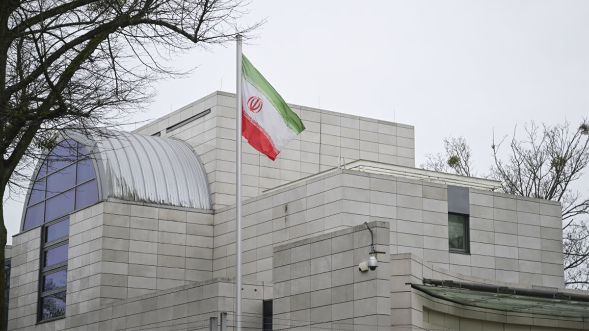 The Iranian flag flies in front of the Iran Embassy in Berlin.