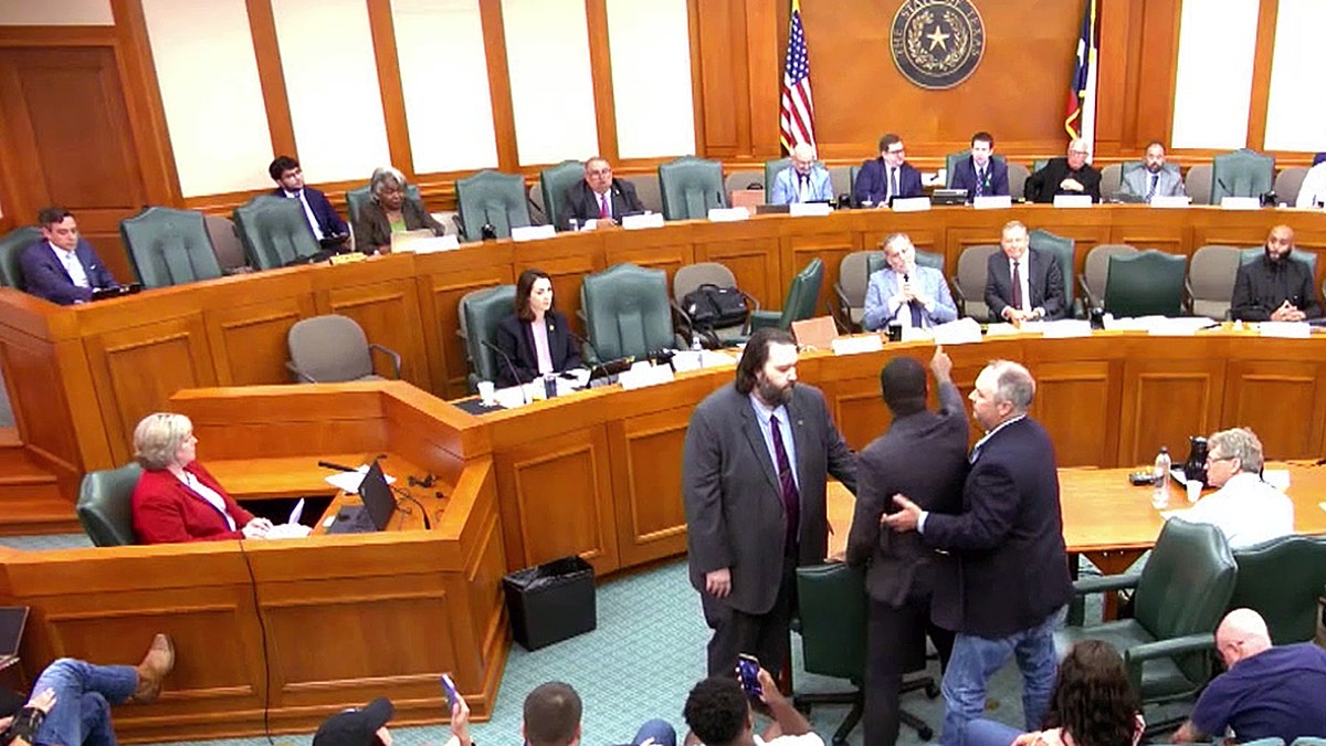 Isaiah Martin confronted by sergeants at Texas redistricting hearing