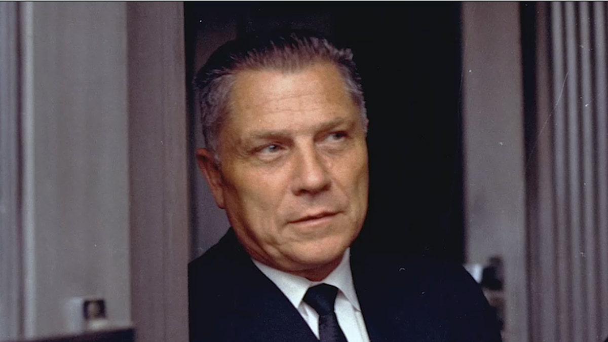 Jimmy Hoffa standing on a doorway