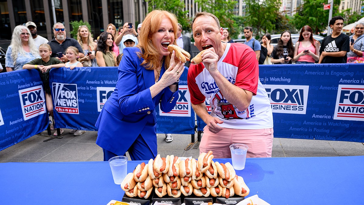 Joey Chestnut with Fox host Liz Claman