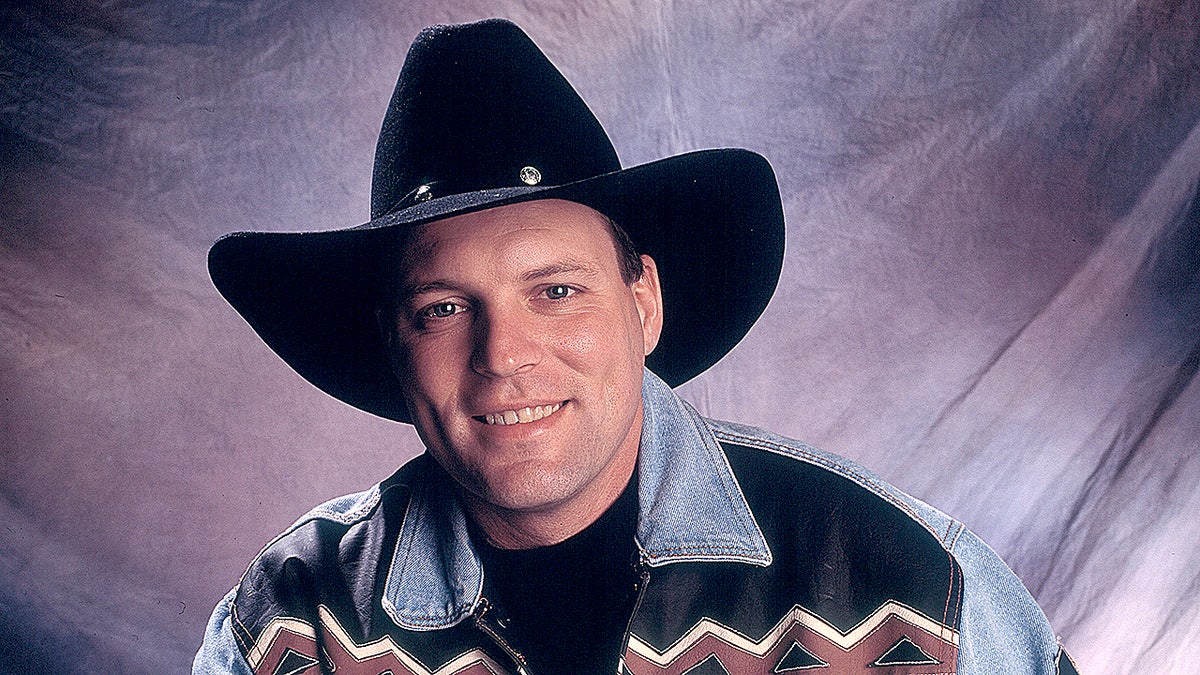 John Michael Montgomery poses for a portrait in a cowboy hat at the Grand Ole Opry