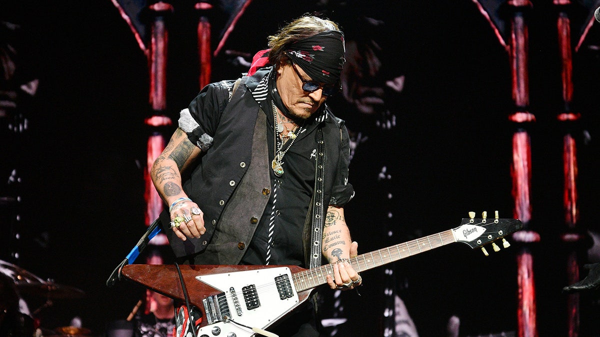 Johnny Depp playing guitar