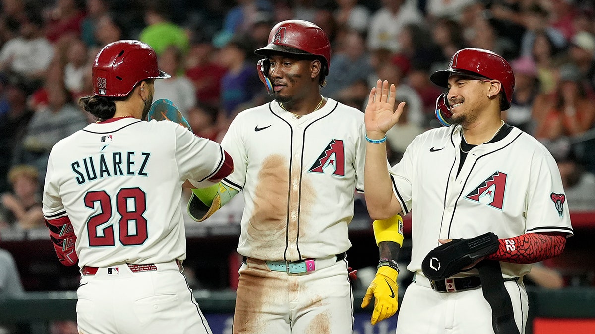 Eugenio Suarez celebrates