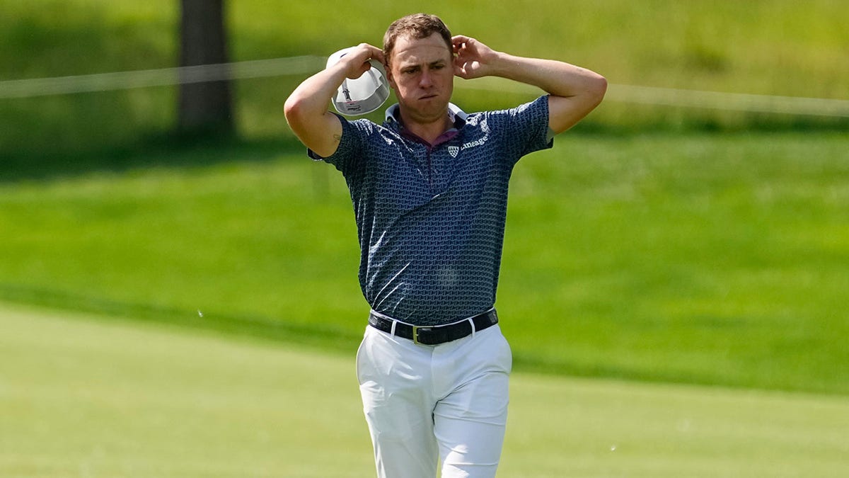 Justin Thomas walks up