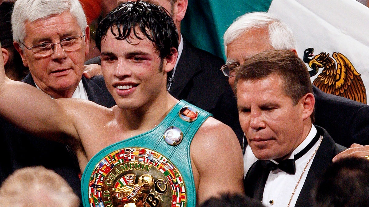 Julio Cesar Chavez, Jr. holds the belt