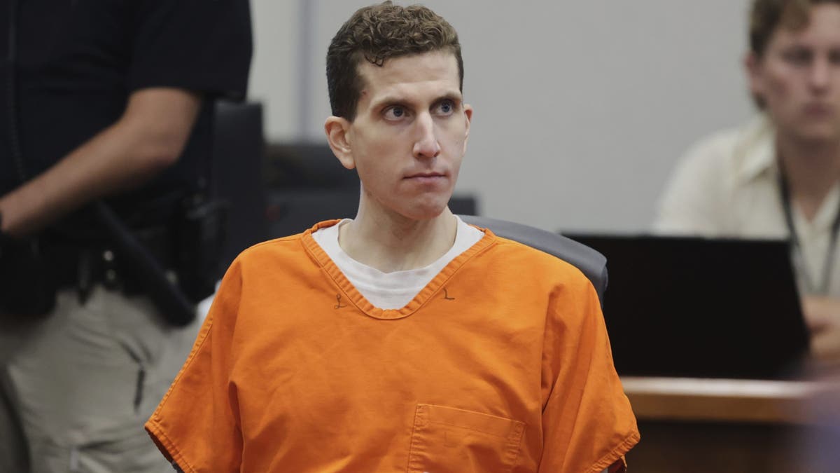 Bryan Kohberger sitting down in court. He's wearing an orange jumpsuit.