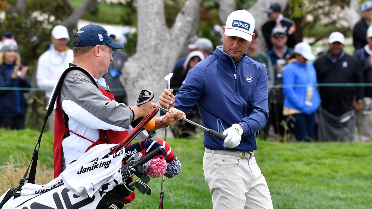 Harris English and caddie on green