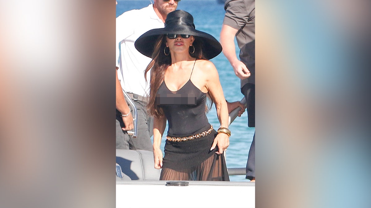 Lauren Sanchez on a black swimsuit with a sheer skirt over it