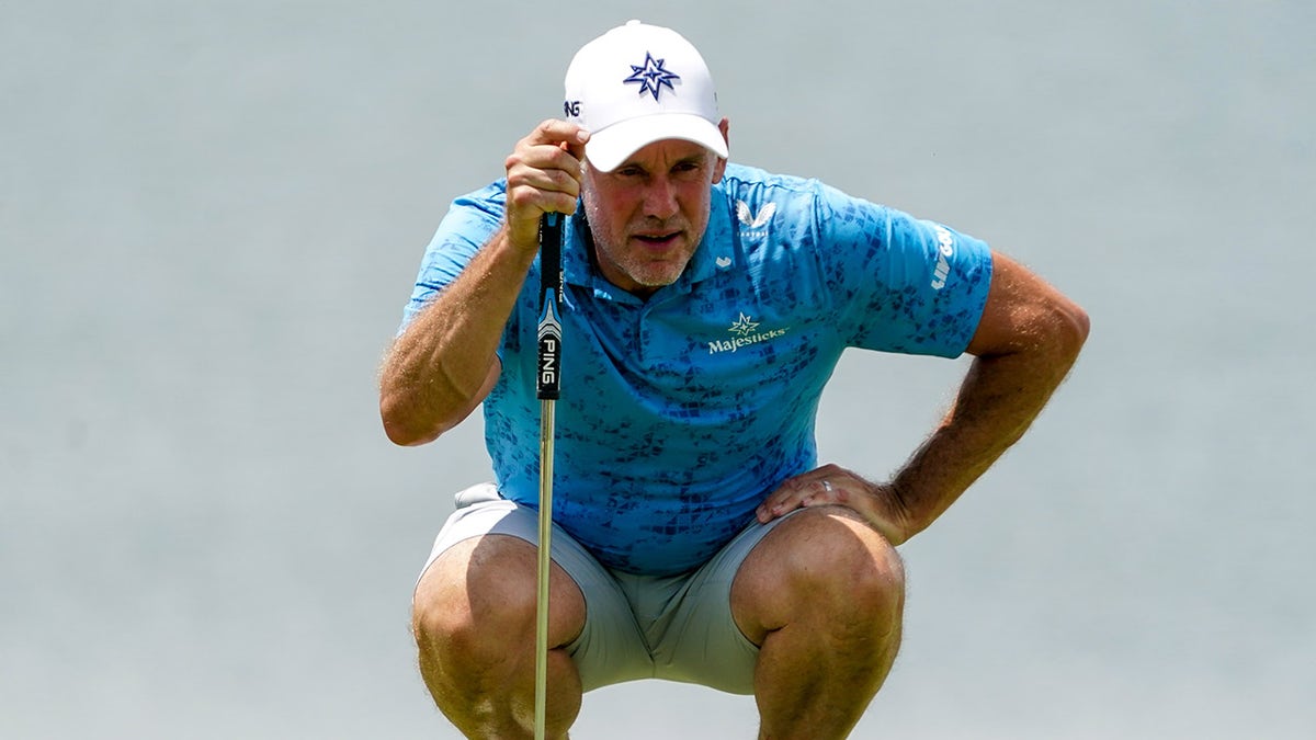 Lee Westwood reads putt