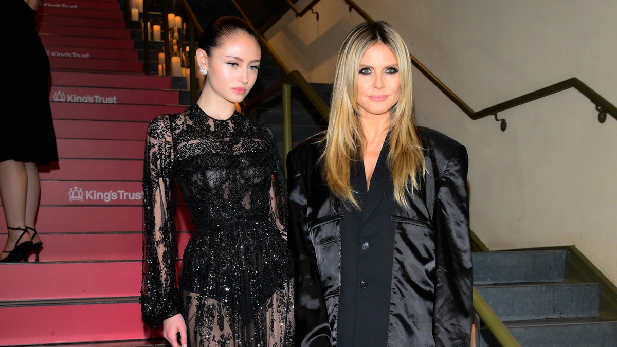 Leni and Heidi Klum posing in black