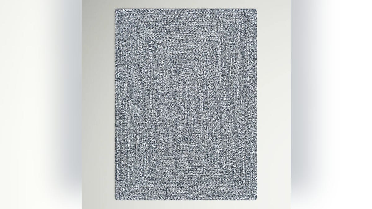 This rug features textured stitching in rectangular shapes.