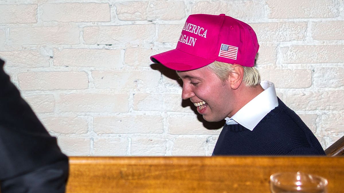 Link Lauren, former advisor to Robert F. Kennedy Jr., climbs the stairwell at the "Make America Hot Again" event Inside Butterworth's in the Capitol Hill neighborhood of Washington, on April 10, 2025.